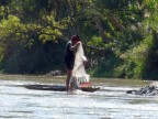 fisherman with cast net and small dugout.JPG (152 KB)